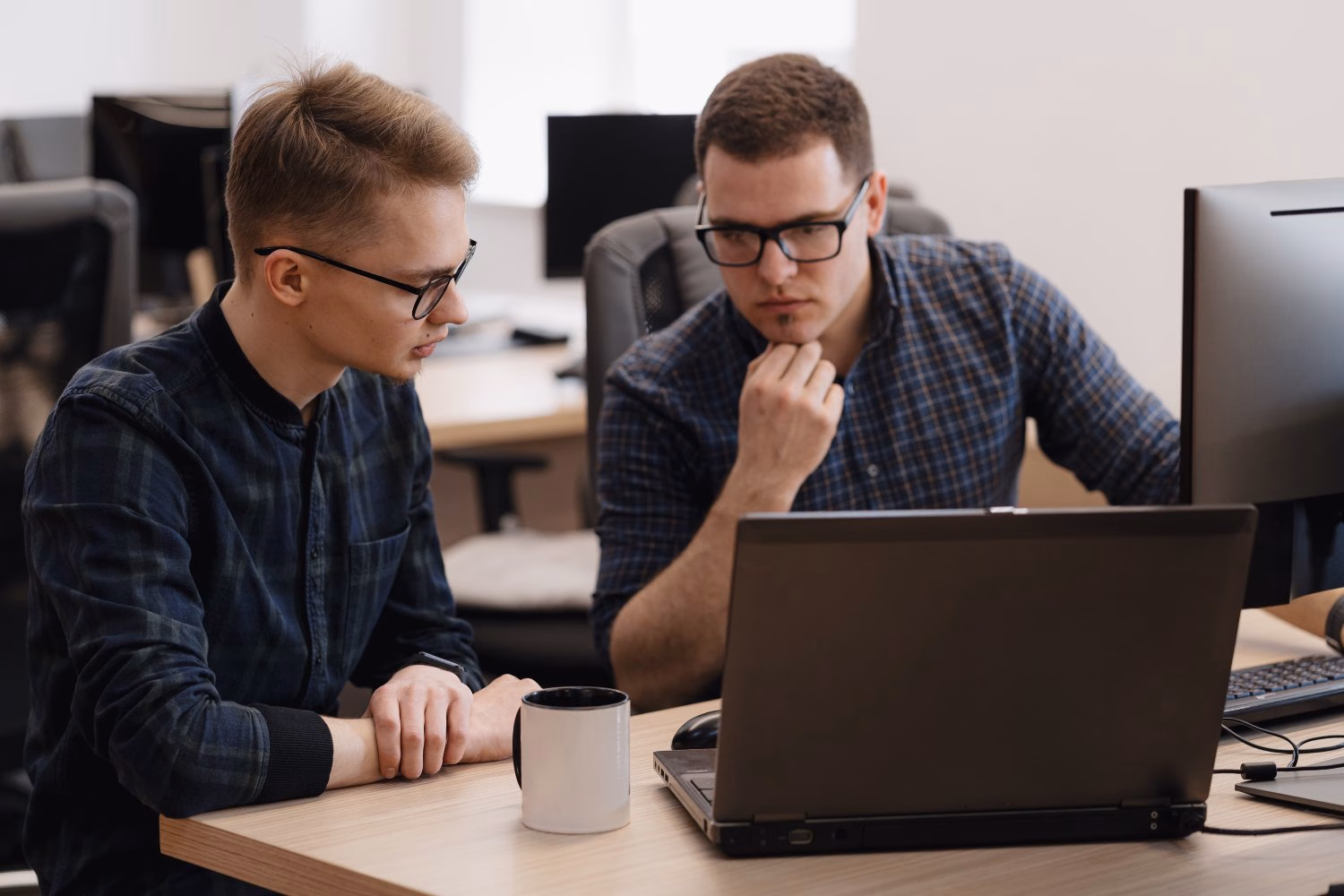 Modern office with IT consultants collaborating on St. Paul business technology solutions